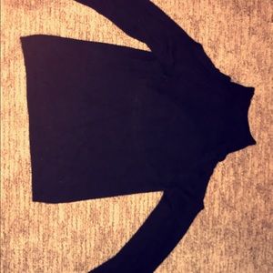 Black turtleneck sweater with shoulder cut outs